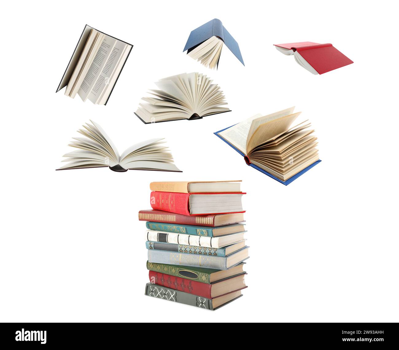 Books flying over stack on white background Stock Photo