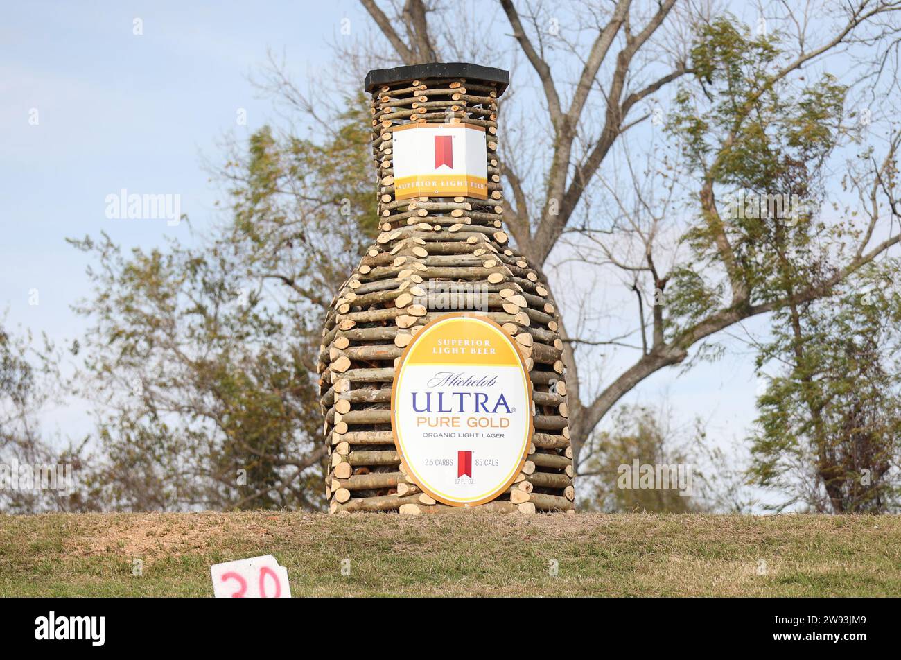 Reserve, USA. 23rd Dec, 2023. A bonfire made into the form of a bottle of Michelob Ultra Pure Gold light beer is on displayed on the River Road in Edgard, Louisiana on Saturday, December 23, 2023. (Photo by Peter G. Forest/Sipa USA) Credit: Sipa USA/Alamy Live News Stock Photo