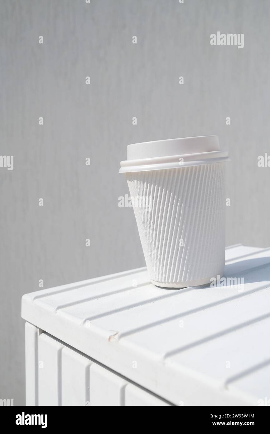 Discarded  white takeaway paper cardboard cup for hot beverage Stock Photo