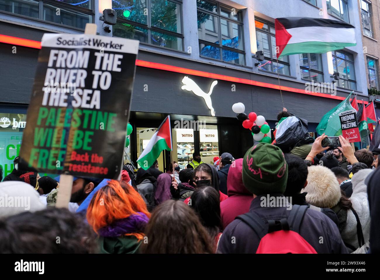 London, UK. 23rd December, 2023. Feminist activist group Sisters Uncut organised a protest in the central shopping areas of Oxford Street and Regent Street, supporting a full ceasefire in Gaza and the boycott of Israeli linked - or owned businesses. Credit: Eleventh Hour Photography/Alamy Live News Stock Photo