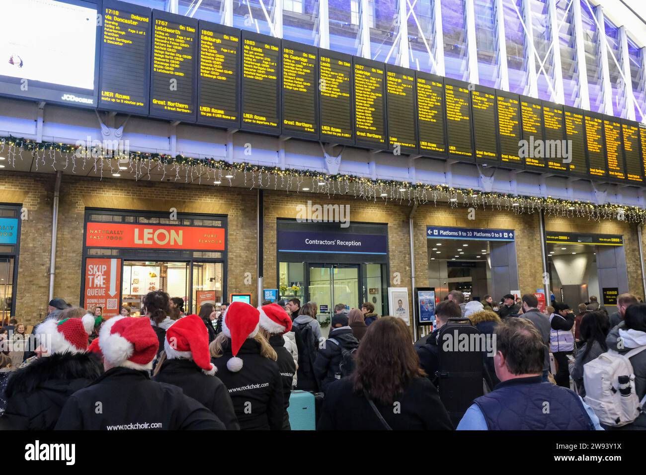 london-uk-23rd-december-2023-festive-travellers-at-king-s-cross