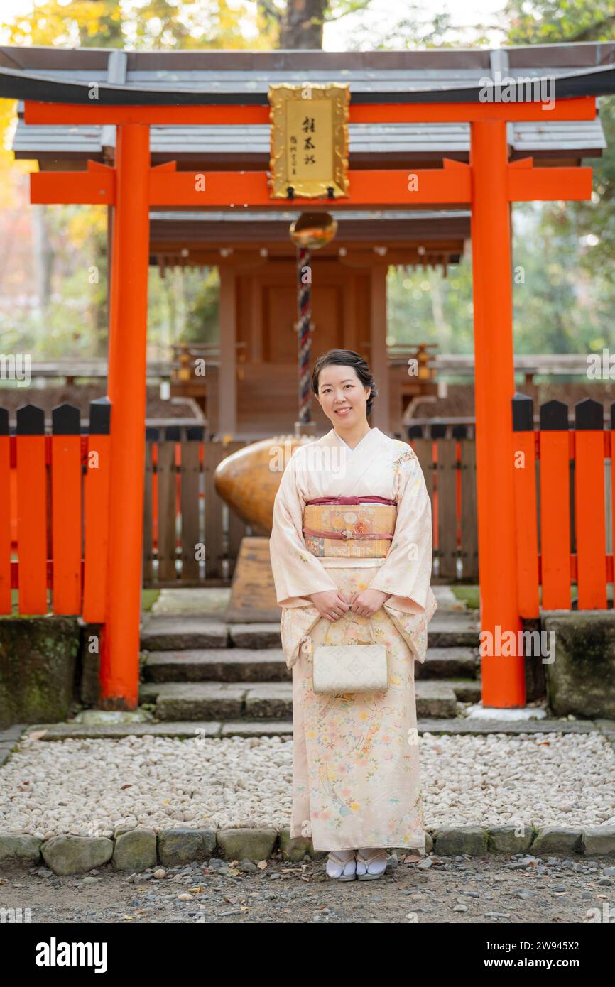 Culturally significant kimono photography at Japanese shrine with traditional torii gate background during optimal timing that respects Japanese cultural traditions and aesthetic principles