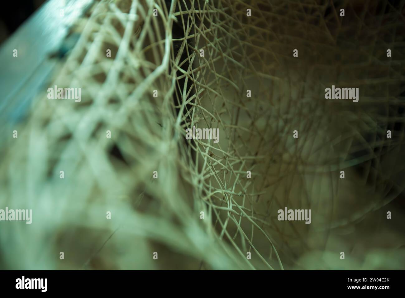 rattan chair or weave chair, completely broken and used. The nets and fixers are meshed up and tangled. Rattan Chair. Stock Photo