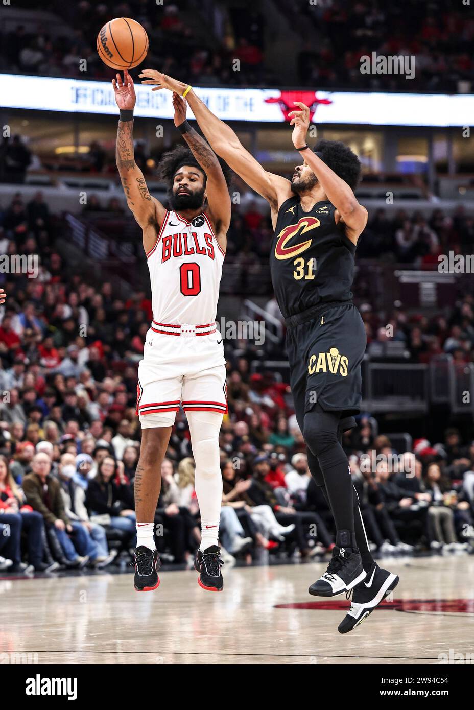 Chicago, USA. 23rd Dec, 2023. Chicago Bulls' Coby White (L) shoots during the NBA regular season game between Cleveland Cavaliers and Chicago Bulls in Chicago, the United States, Dec. 23, 2023. Credit: Joel Lerner/Xinhua/Alamy Live News Stock Photo