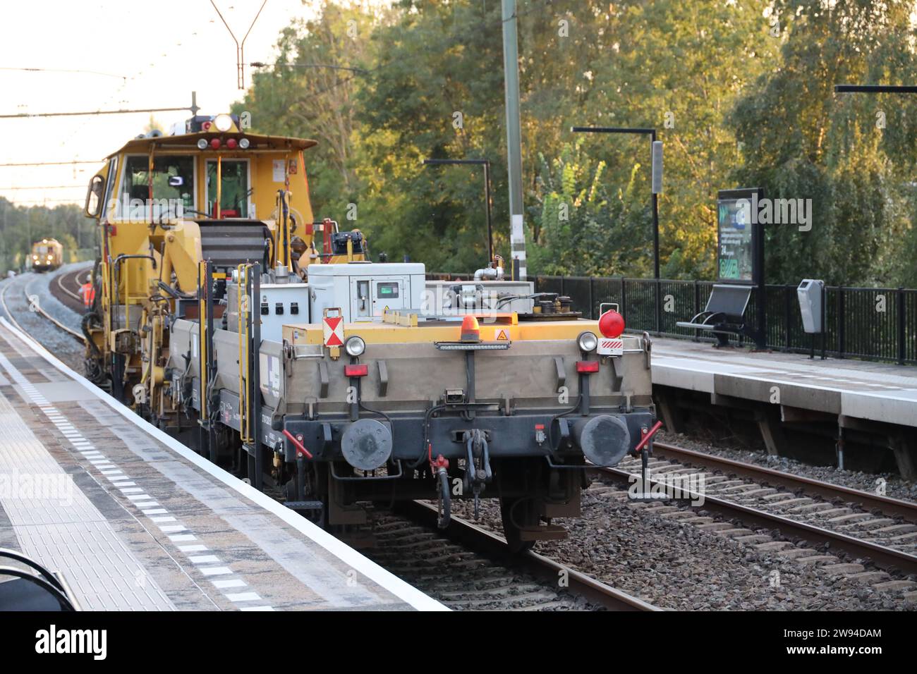 Rail construction train along platform of station Nieuwerkerk aan den ...