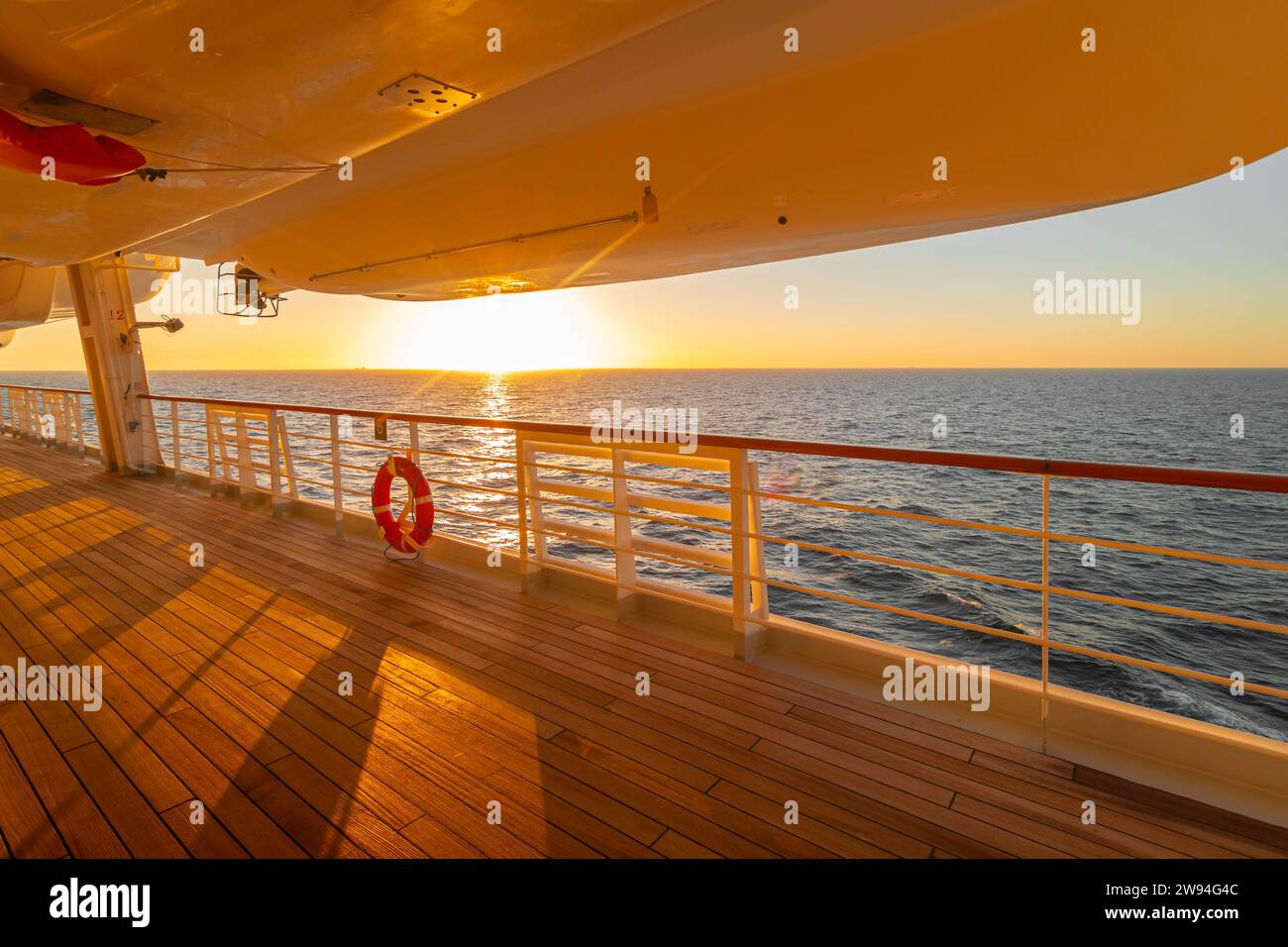 Sunset cruise ship promenade deck Stock Photo - Alamy