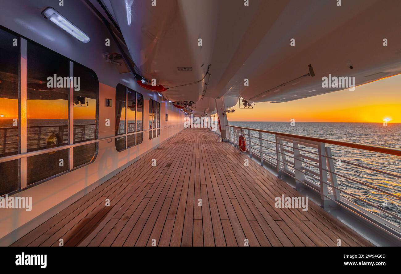Sunset cruise ship promenade deck Stock Photo - Alamy