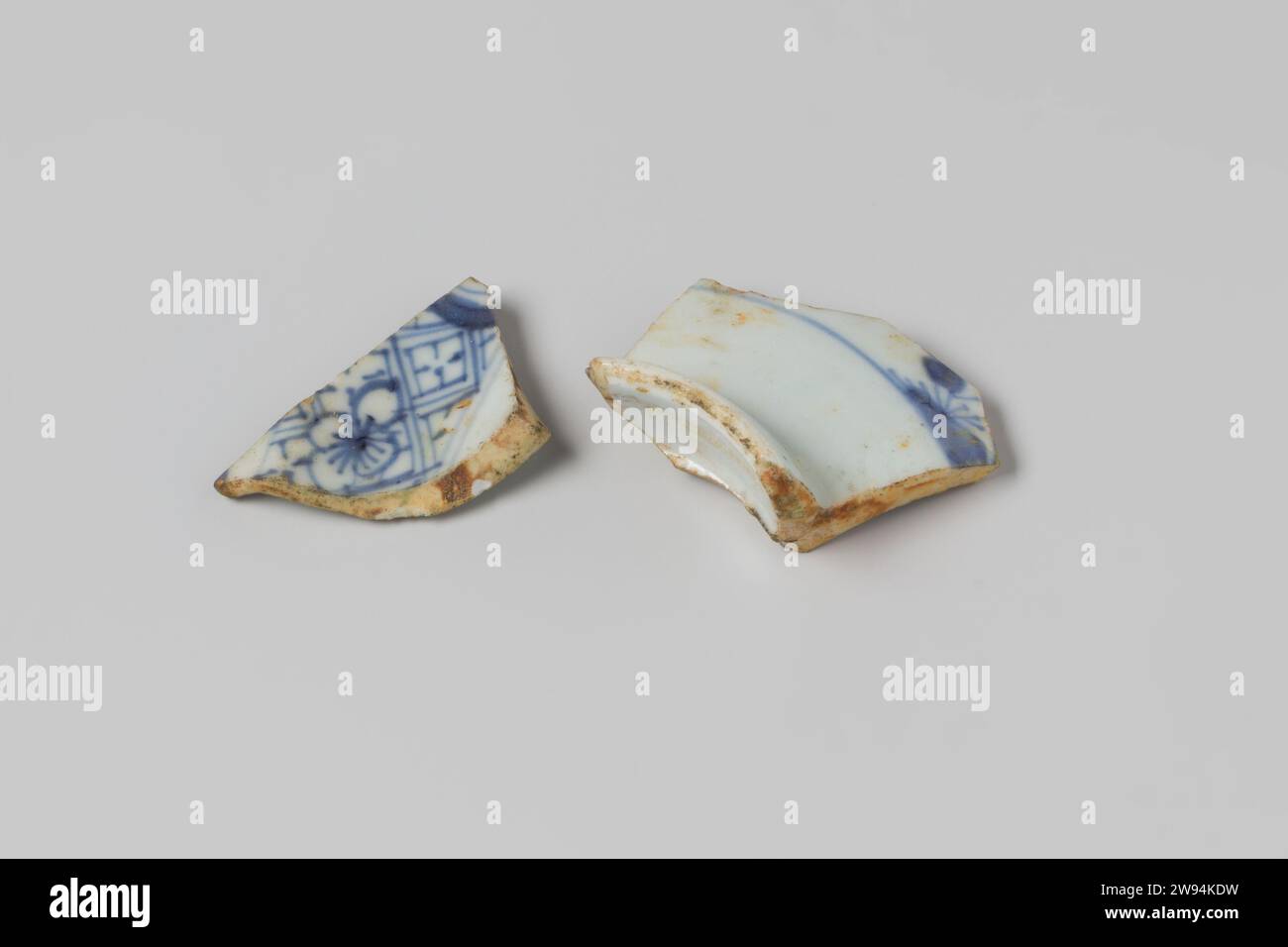 Shards of a sign from the wreck of the East Indians Hollandia, Anonymous, 1700 - in Or Before 1743 plate (dishes) Porcelain, plate, fragment; fragm of cavetto, decorated with diaper pattern and flowers, set off with a double band. Netherlands porcelain   Second Stock Photo