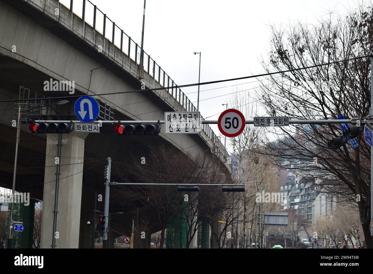 Korean traffic lights showing red next to elevated highway in Seodaemun