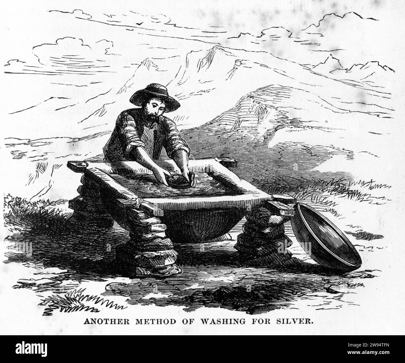 Engraving of a miner washing silver, from The Underground World, circa 1878 Stock Photo