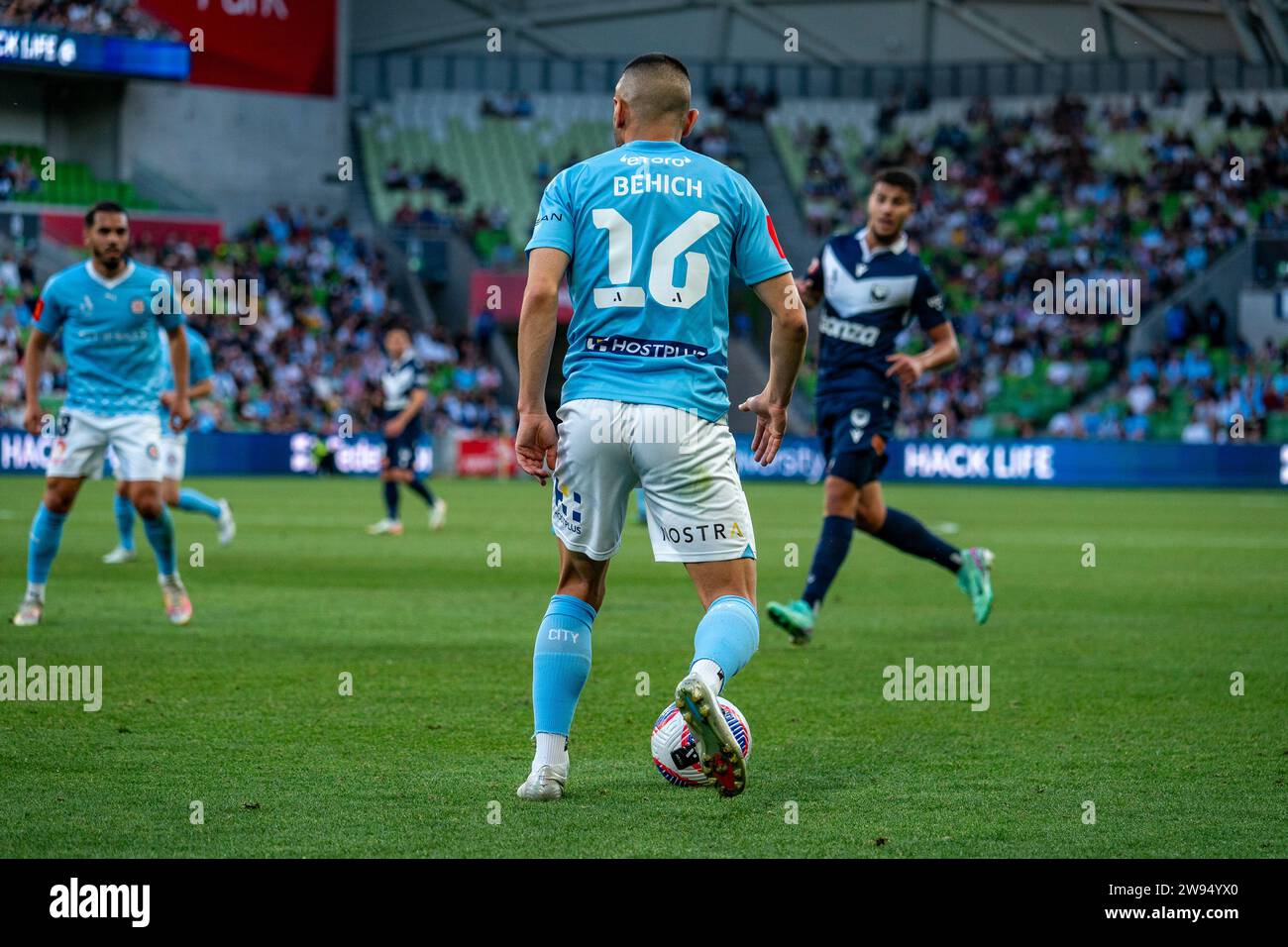 Melbourne, Australia. 23 December, 2023. Melbourne City FC Defender Aziz Behich (#16) looks to play the ball forward during the Isuzu UTE A-League match between Melbourne City FC and Melbourne Victory FC at AAMI Park in Melbourne, Australia. Credit: James Forrester/Alamy Live News Stock Photo