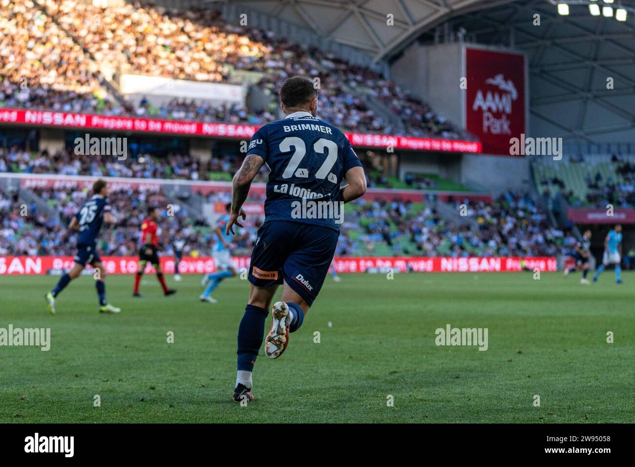 Melbourne, Australia. 23 December, 2023. Melbourne Victory FC Midfielder Jake Brimmer (#22) runs forwards for a counter attack during the Isuzu UTE A-League match between Melbourne City FC and Melbourne Victory FC at AAMI Park in Melbourne, Australia. Credit: James Forrester/Alamy Live News Stock Photo