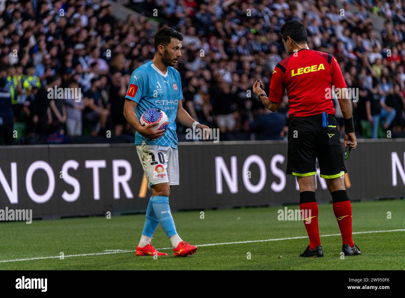 Melbourne, Australia. 23 December, 2023. Melbourne City FC Midfielder Tolgay Arslan (#10) gets a talking to from match official Alireza Faghani during the Isuzu UTE A-League match between Melbourne City FC and Melbourne Victory FC at AAMI Park in Melbourne, Australia. Credit: James Forrester/Alamy Live News Stock Photo