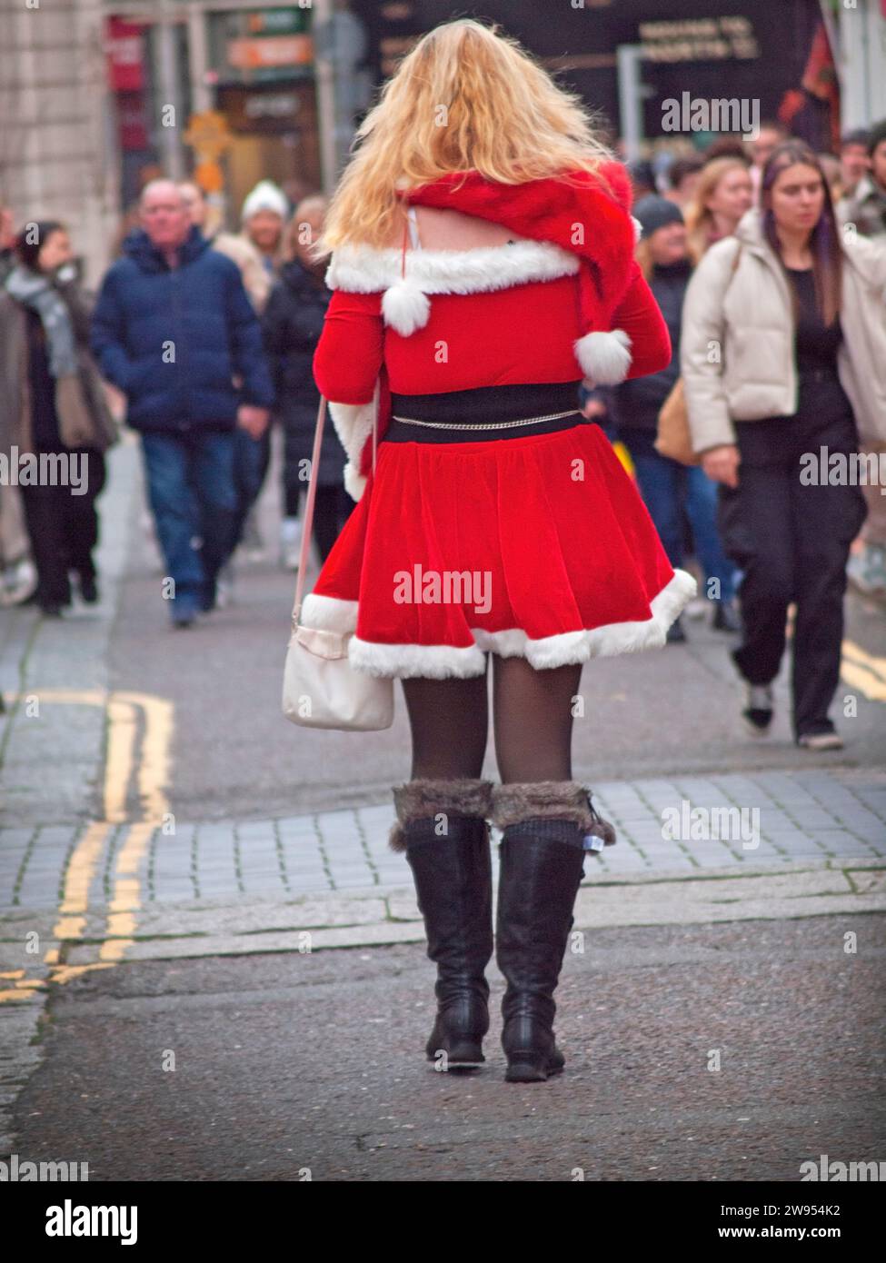 A female Santa Claus on a Brighton street Stock Photo