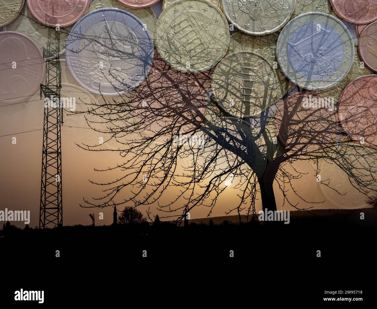 Highvoltage pylon at sunset in front of a small village with a church