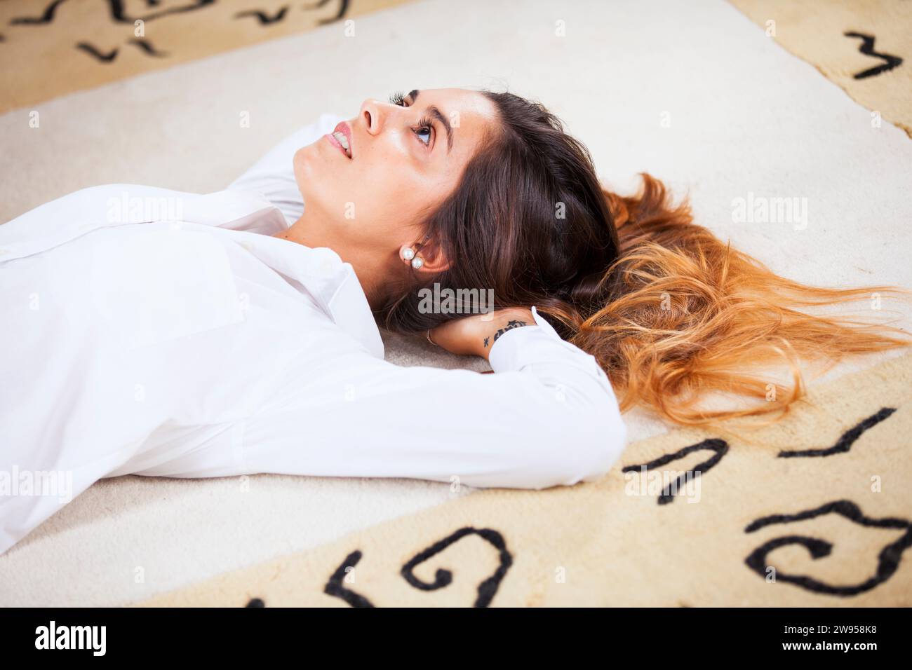 Woman lay floor hi-res stock photography and images - Alamy