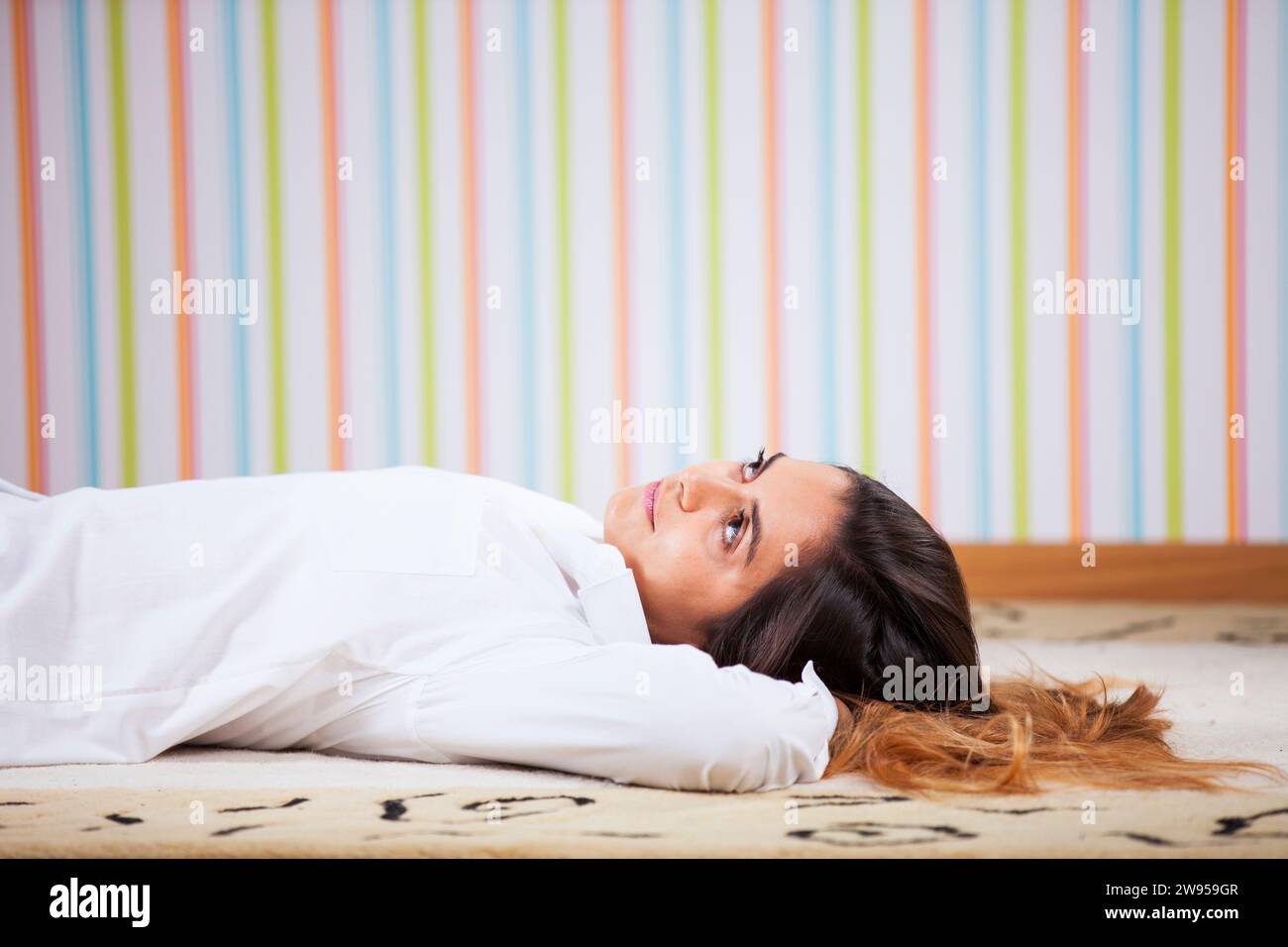Woman lay floor hi-res stock photography and images - Alamy
