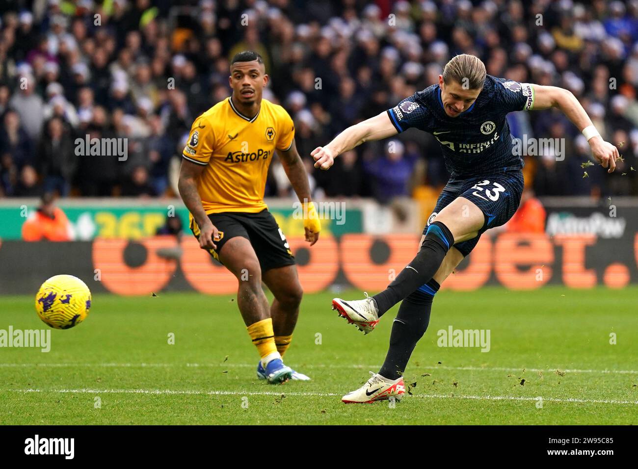 Chelsea's Conor Gallagher (right) attempts a shot on goal during the Premier League match at Molineux Stadium, Wolverhampton. Picture date: Sunday December 24, 2023. Stock Photo