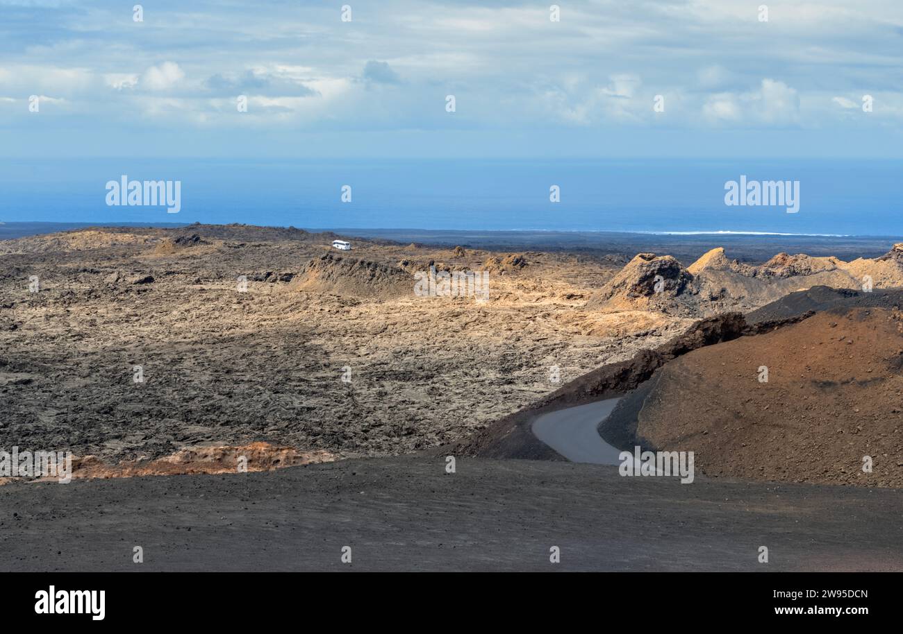 Winding road through  Timanfaya National Park, Lanzarote, Canary Islands, Spain also known as Parque Nacional de Timanfaya Stock Photo