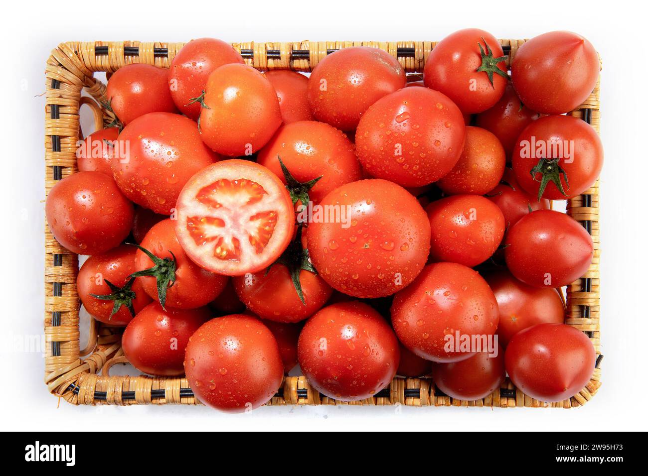 tomatoes in a basket Stock Photo - Alamy