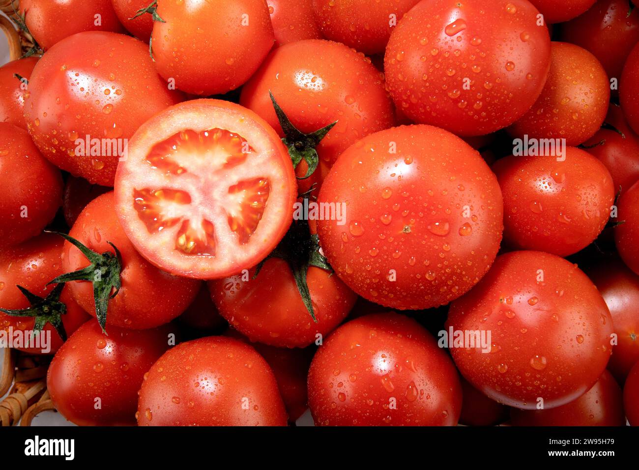 tomatoes in a basket Stock Photo - Alamy