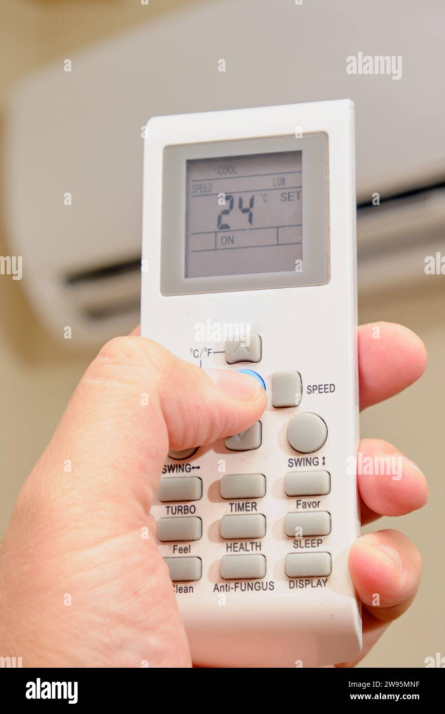 The process of turning off the air conditioner in the home living room, closeup Stock Photo Alamy