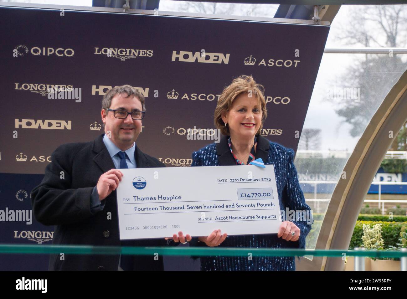 Ascot, Berkshire, UK. 23rd December, 2023. Catherine McLaughlin the CEO of Thames Hospice in Bray, Berkshire was presented with a cheque for £14,770 today on behalf of Thames Hospice from Ascot Racecourse at the Howden Christmas Racing Weekend. Ascot Racecourse said that they were 'pleased to annouce that during 2022-2023 public donations and online ticket purchases raised £14,770 for their nominated charity, Thames Hospice'. Credit: Maureen McLean/Alamy Live News Stock Photo