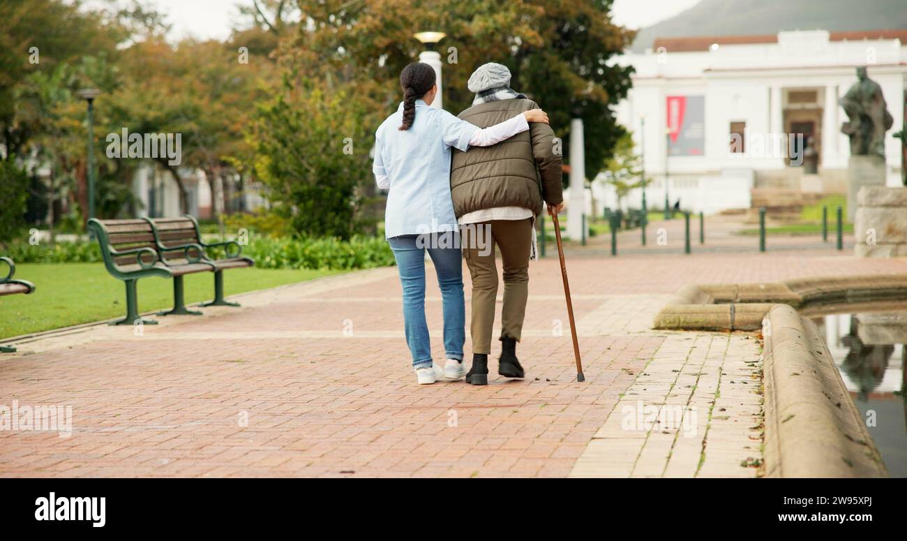 Old woman walking stick park hi-res stock photography and images - Alamy