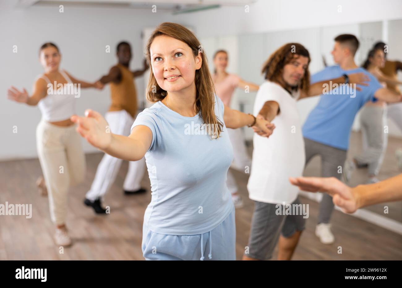 Adult couples dancing active dance together in studio Stock Photo