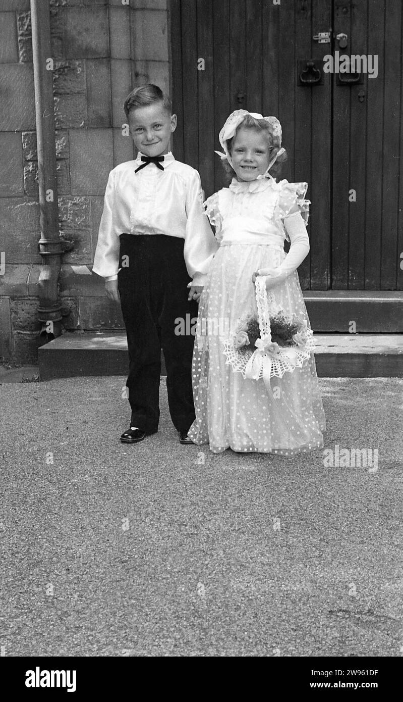 1950s, historical, wedding, big smiles from the page boy and flower