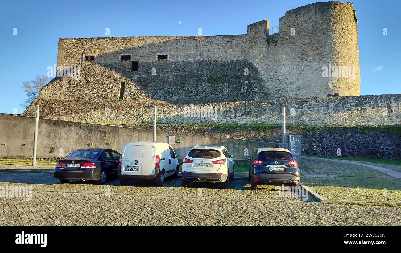 Bastions and ramparts of the Castle of Abrantes, northern side with the entrance ramp, view in sunset light, Abrantes, Portugal Stock Photo