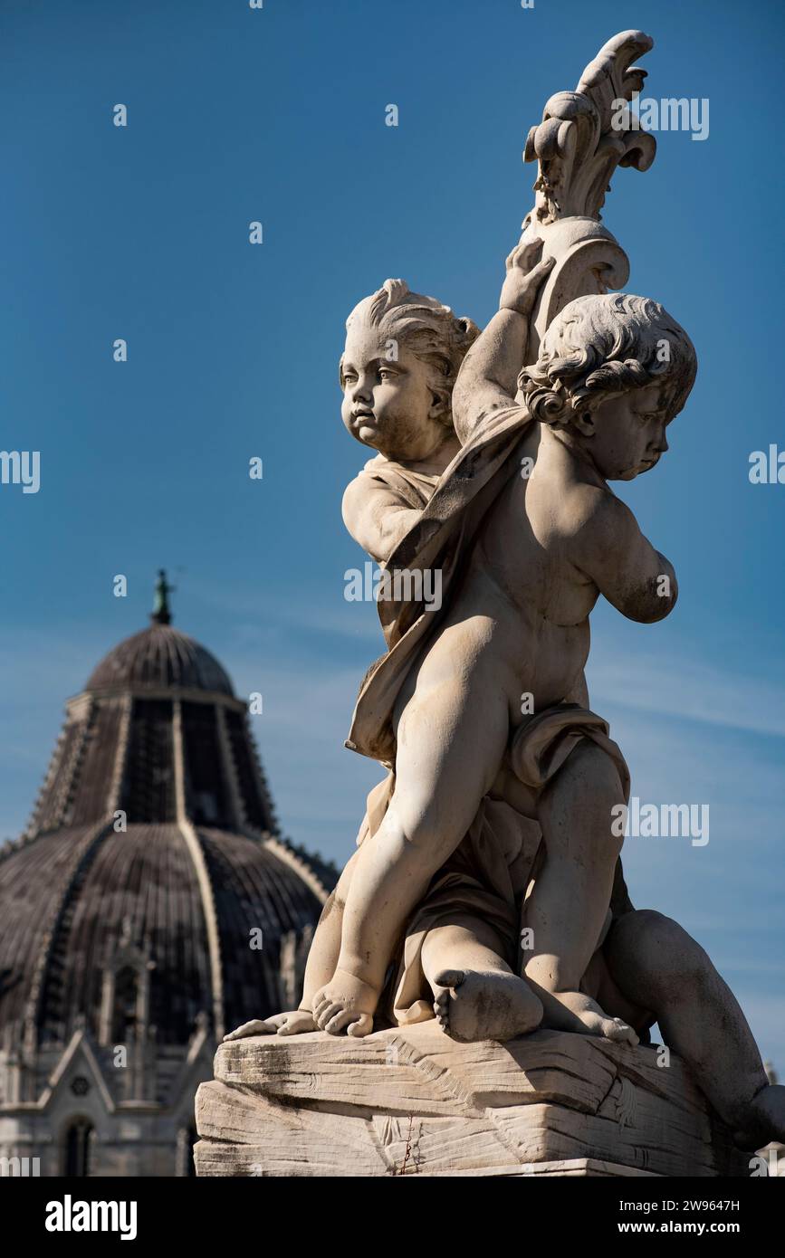 Fontana dei Putti by Giovanni Antonio Cybei e Giuseppe Vacca. The leaning tower in the background. It is locate in Piazza dei Miracoli Stock Photo
