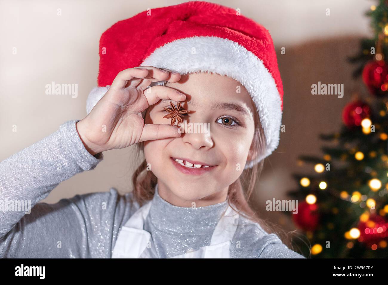 Cheerful girl closes her eyes with anise seed Stock Photo Alamy