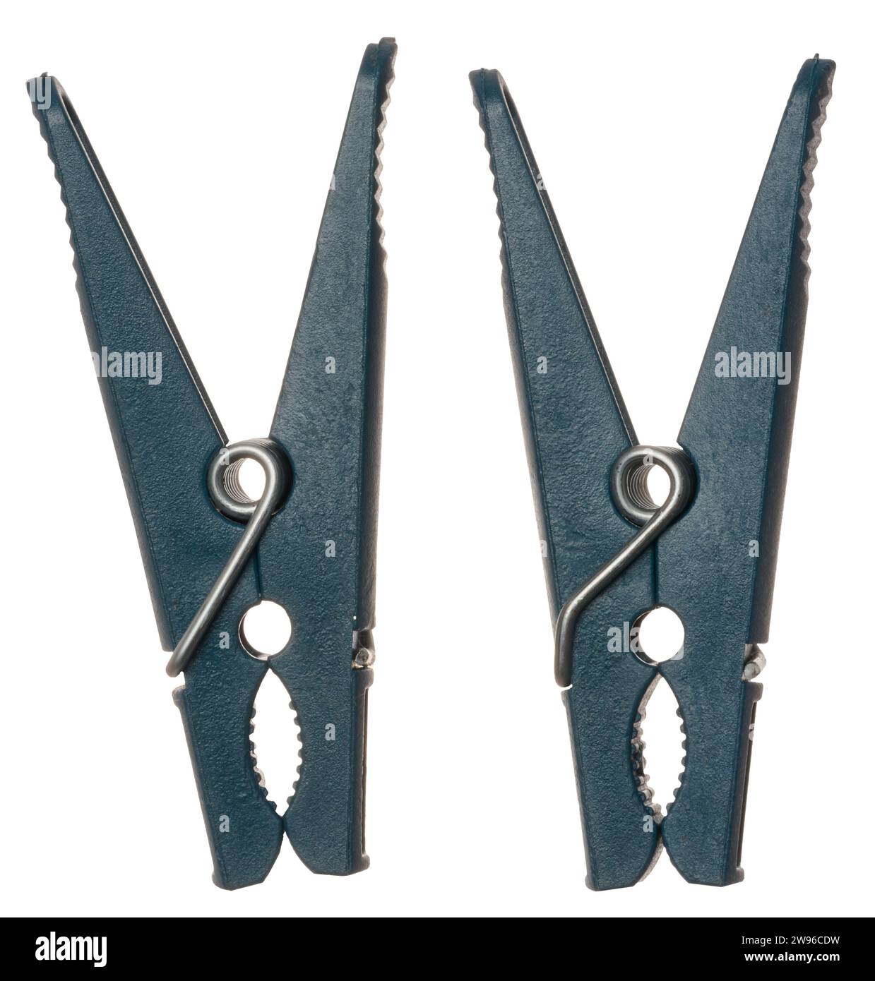 Two blue plastic clothespins on isolated background Stock Photo Alamy