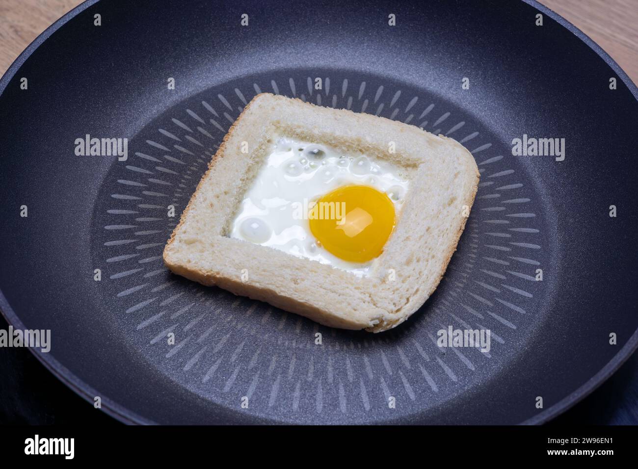 close up of Freshly cooked fried egg inside a bread Stock Photo