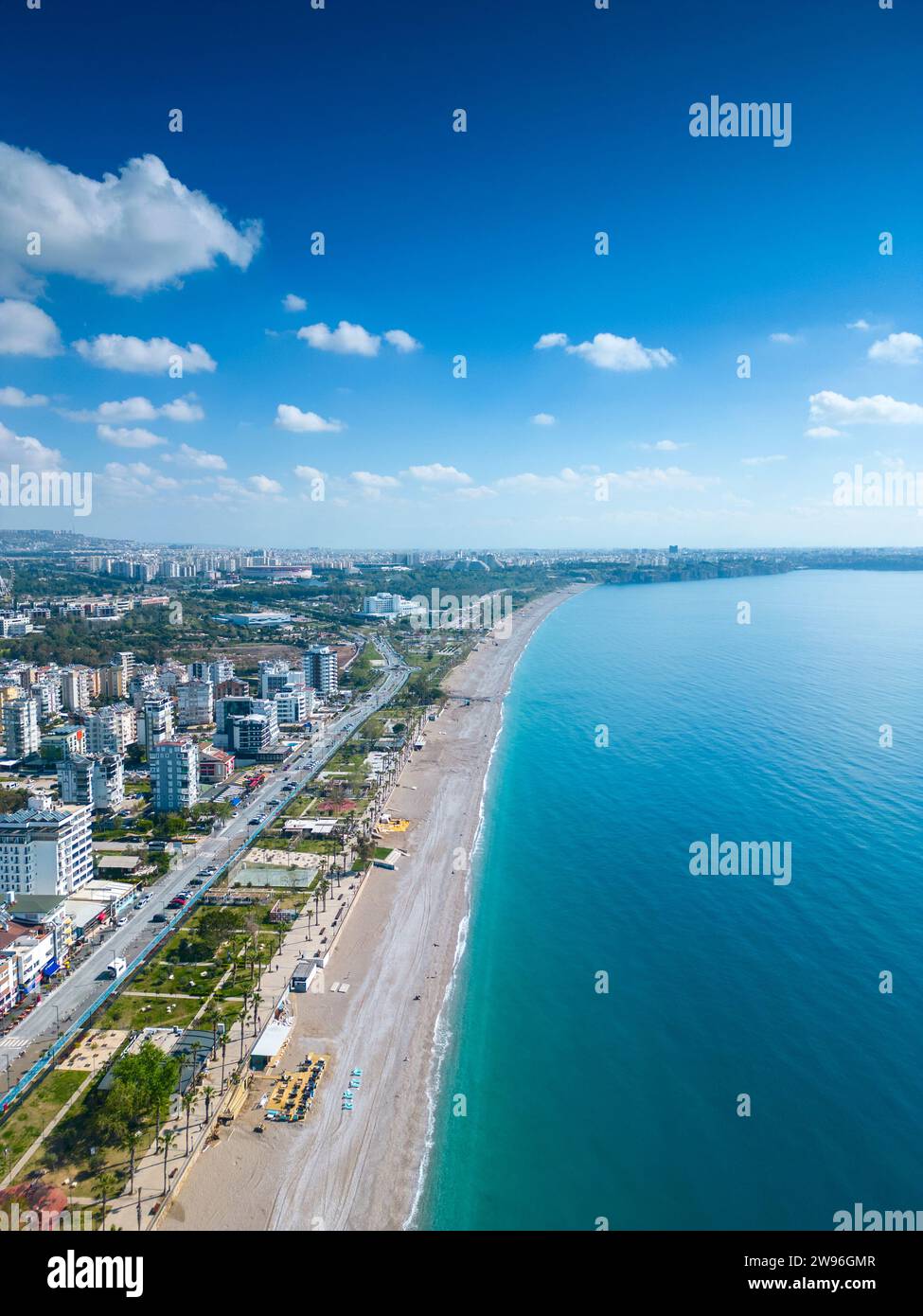 Awesome view of Konyaalti Beach and Park in Antalya, Turkey. Drone flying over the beach. Konyaalti Beach is a popular tourist attraction in Turkey. Stock Photo