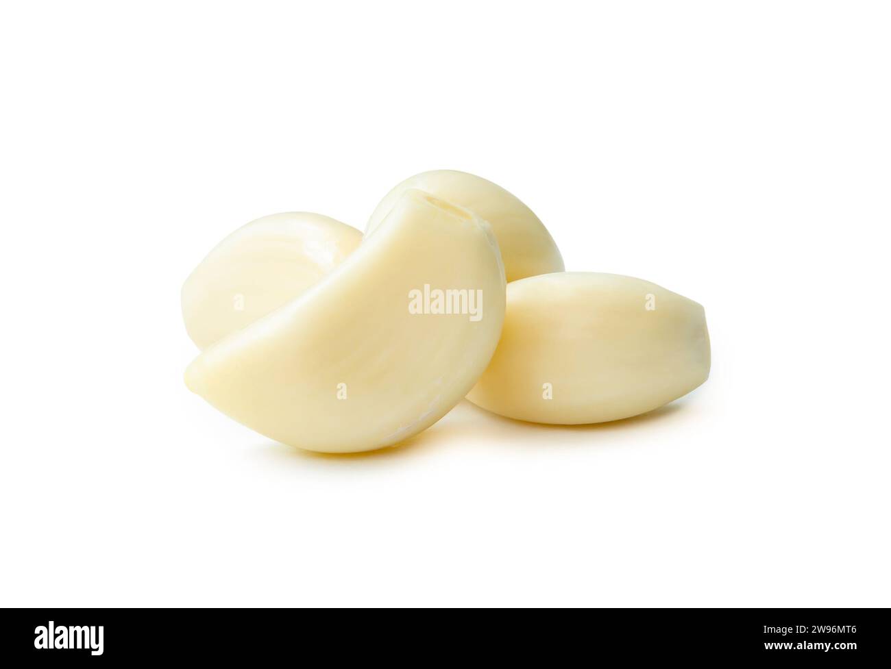 Peeled garlic cloves in stack are isolated on white background with ...