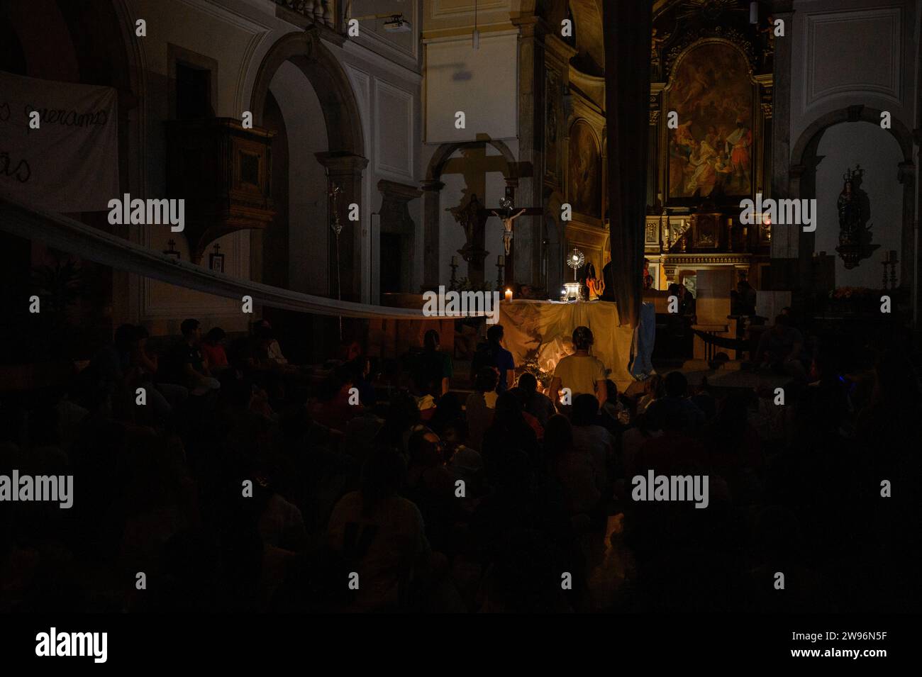 Adoration of the Blessed Sacrament during WYD 2023 accompanied by Hakuna Group Music. Church of the Three Saint Magi (Igreja dos Santos Reis Magos). Stock Photo