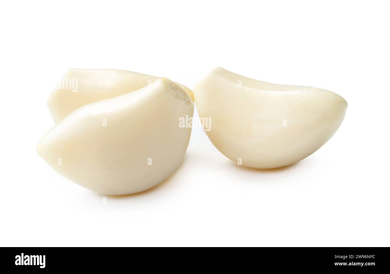 Peeled garlic cloves in stack is isolated on white background with