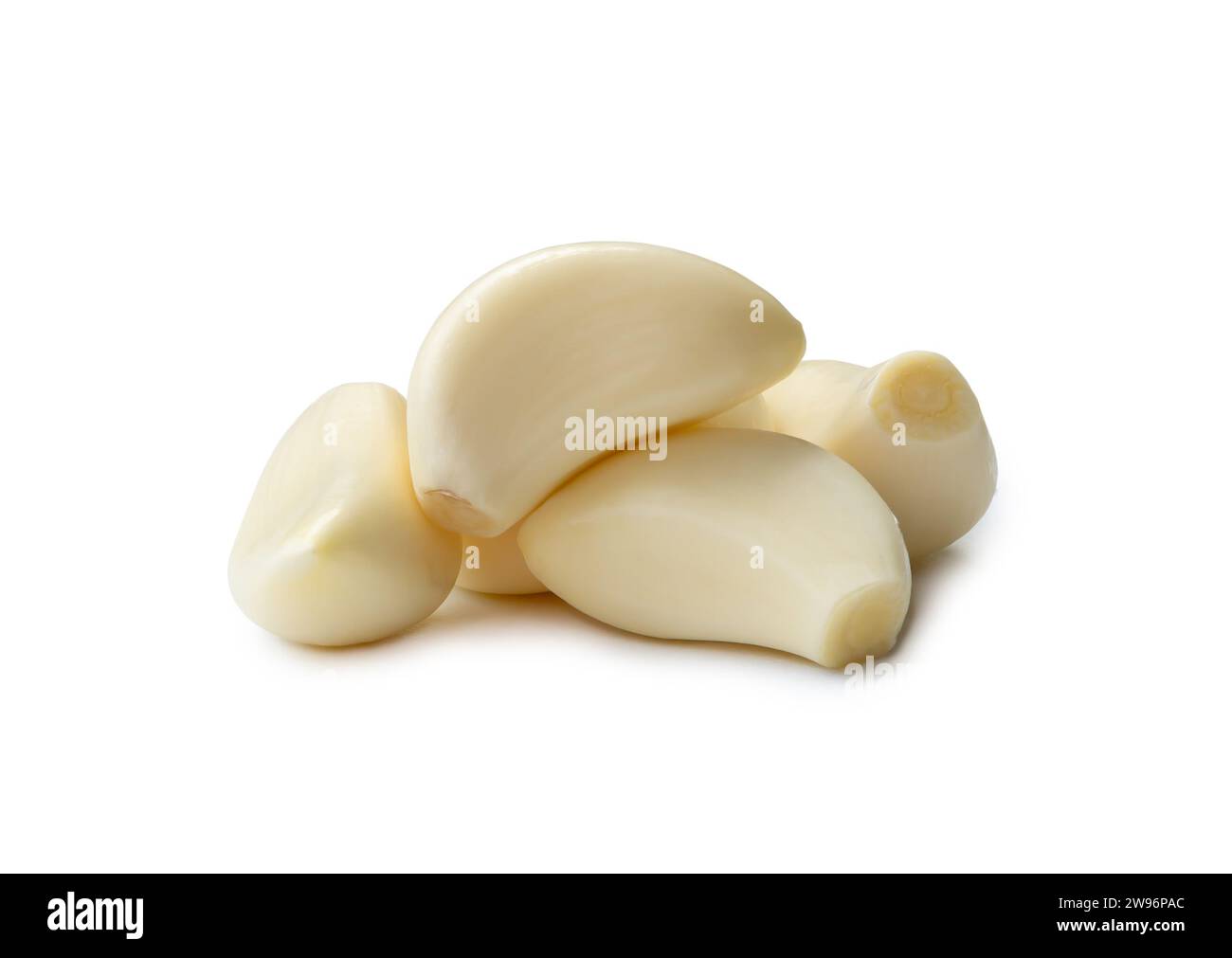 Peeled garlic cloves in stack are isolated on white background with ...