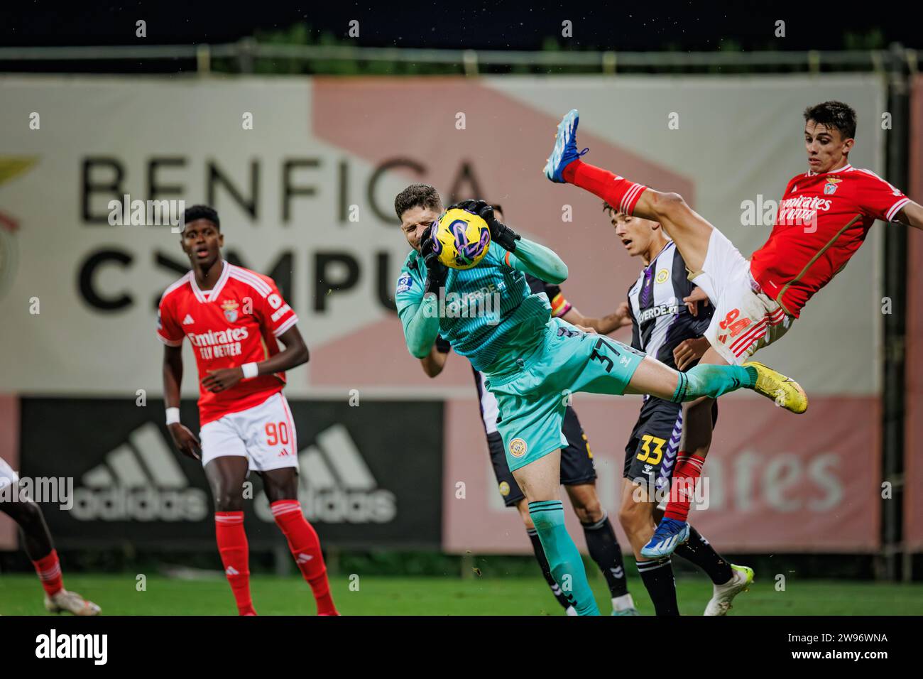 Lucas Oliveira (goalkeeper) catches the ball between Benfica defenders during Liga Portugal 2 Sabseg 23/24 game between SL Benfica B and CD Nacional a Stock Photo
