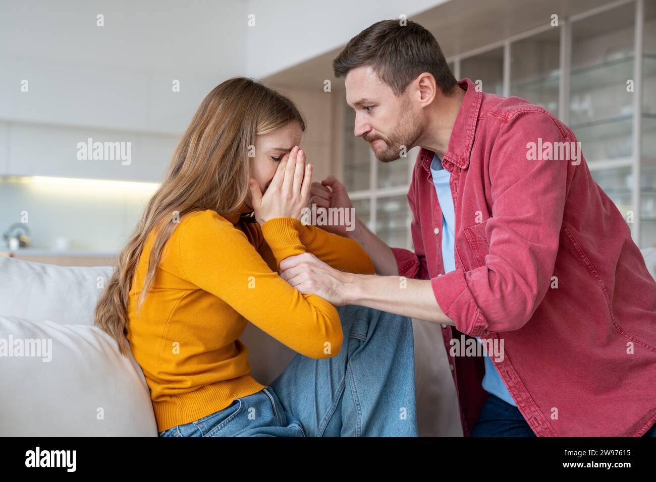 Aggressive husband ready to hit, beat crying wife. Domestic violence, harassment in family life