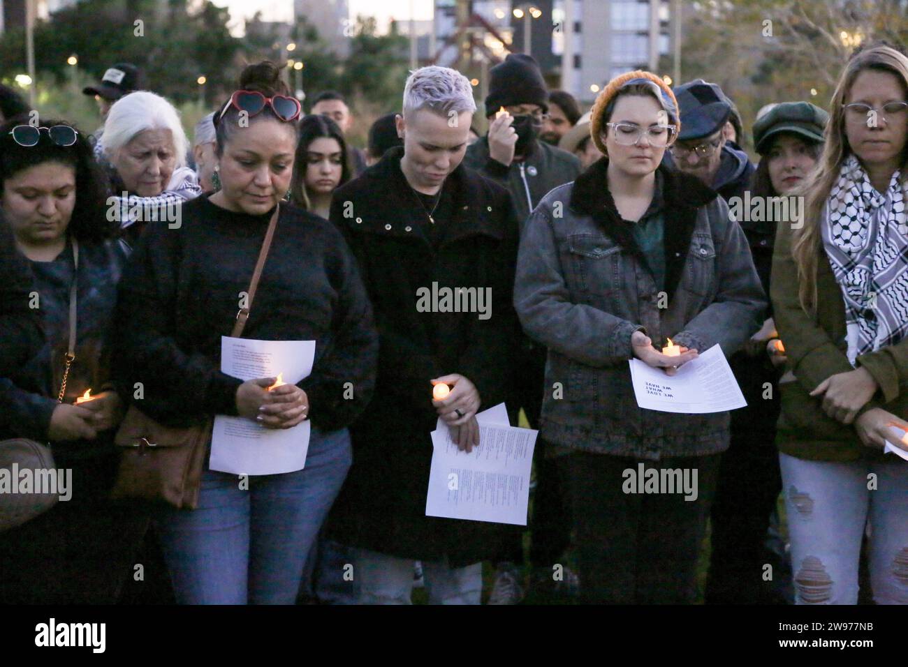 People gathered for a peaceful candlelight vigil with songs and prayers