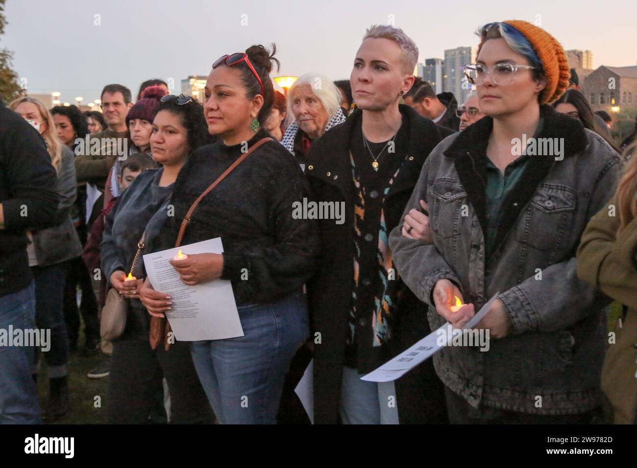 People gathered for a peaceful candlelight vigil with songs and prayers