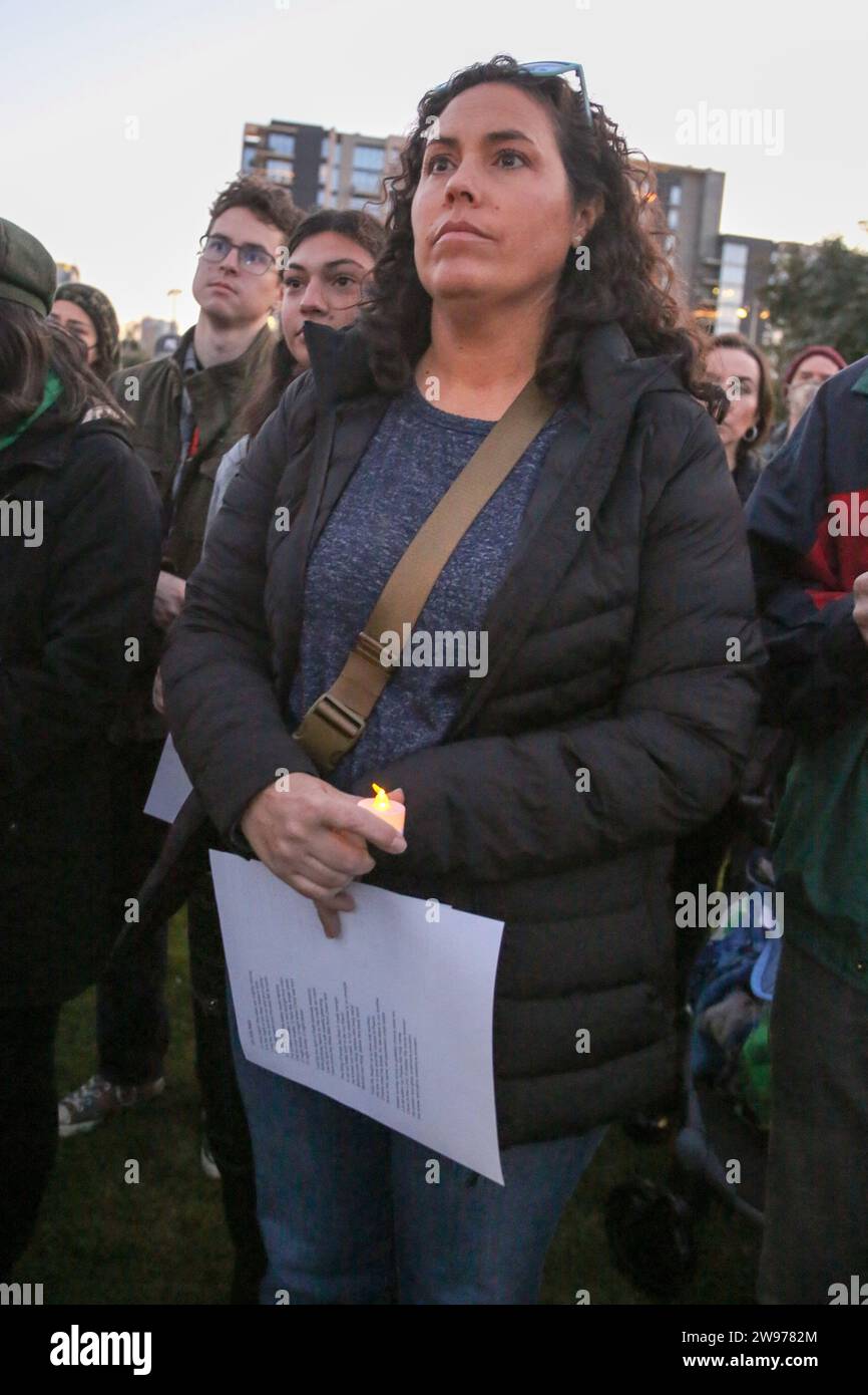 People gathered for a peaceful candlelight vigil with songs and prayers to call for a permanent