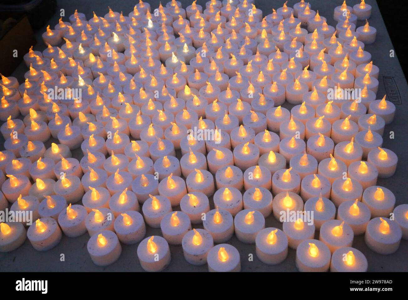 Candles are set out for people that gathered for a peaceful candlelight