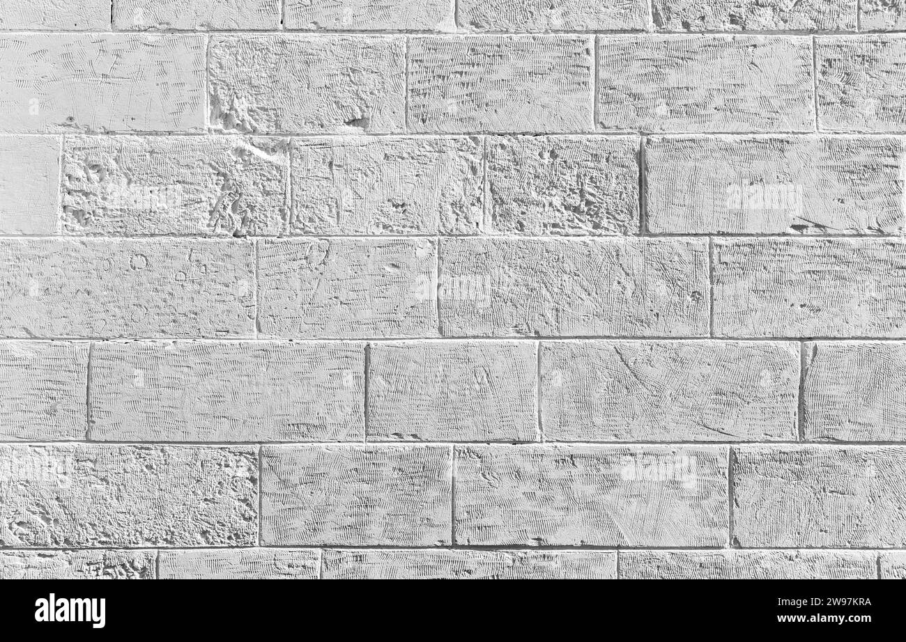 White wall made of decorative concrete blocks, background photo texture Stock Photo