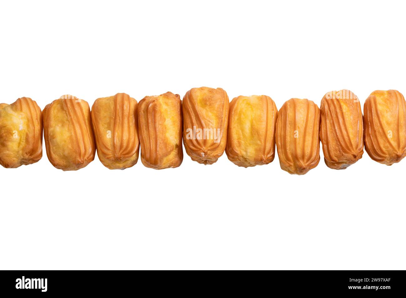 Sweet eclairs isolated on a white background. Top view. Stock Photo