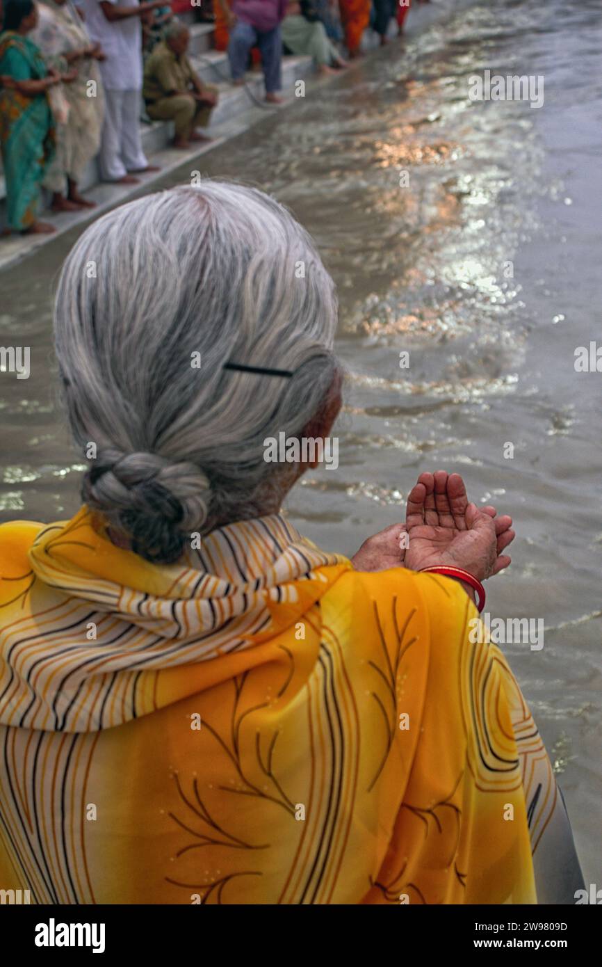 Woman kneeling in prayer hi-res stock photography and images - Alamy