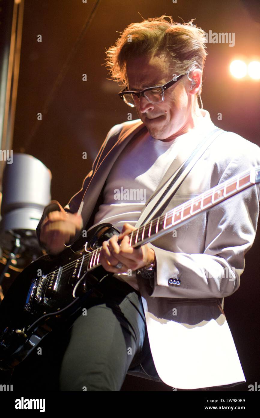 Tom Fletcher of band McFly playing guitar at Newmarket Racecourse Stock Photo